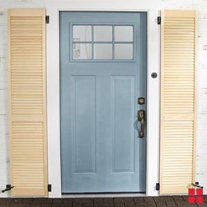 Yellow shutters around blue front door.