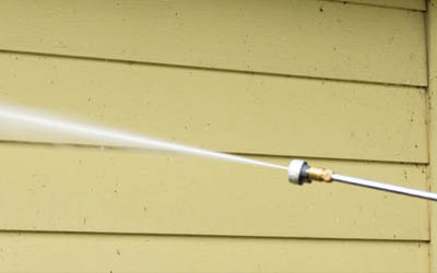 pressure washing the exterior of a home