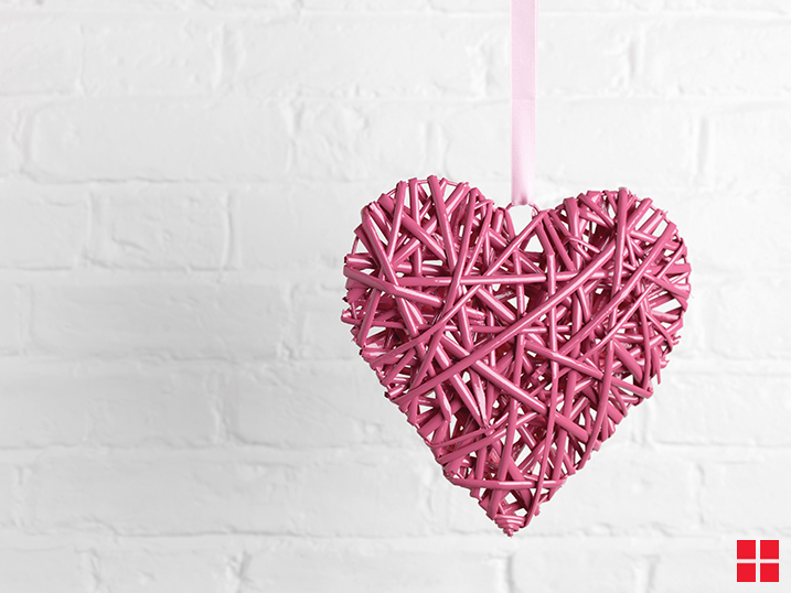Pink heart made from wood and string